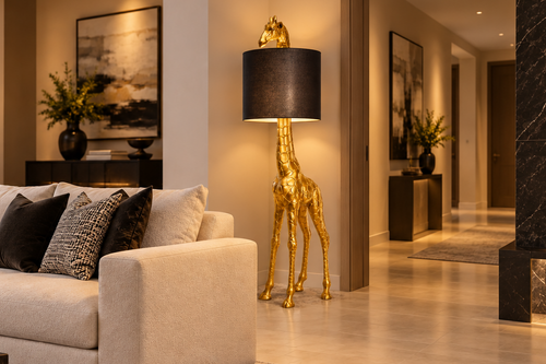 Gold giraffe floor lamp with black shade standing beside a hallway doorway in a large luxury lounge