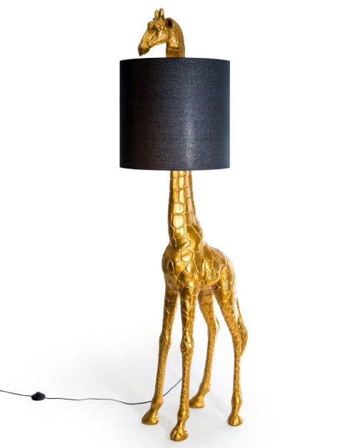 Gold giraffe-shaped lamp with a black lampshade on a white background